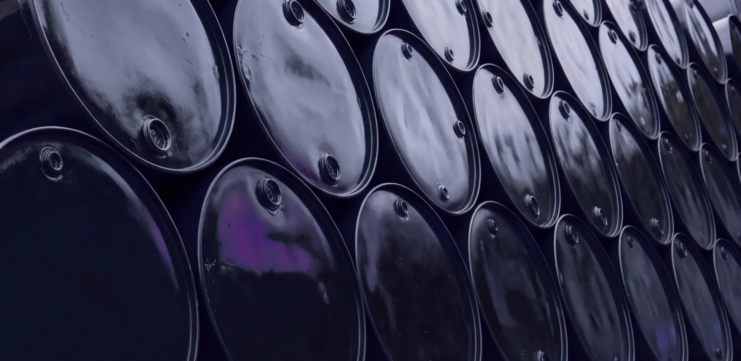 Geometric rows of dark petroleum drums